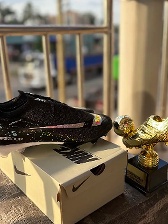 Black speckled football boots